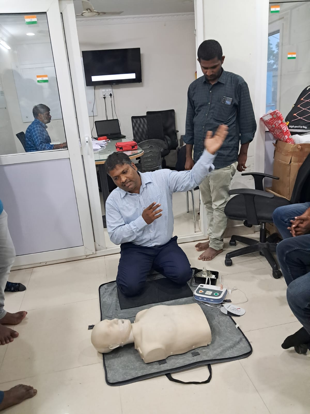 CPR and AED demonstration during a first-aid training session